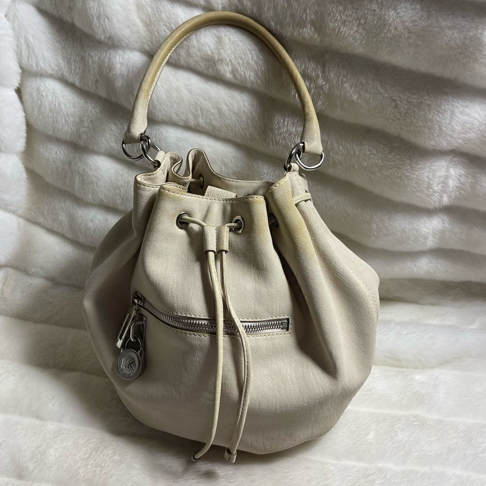 Michael Michael Kors leather beige drawstring bucket satchel.silver tone accents